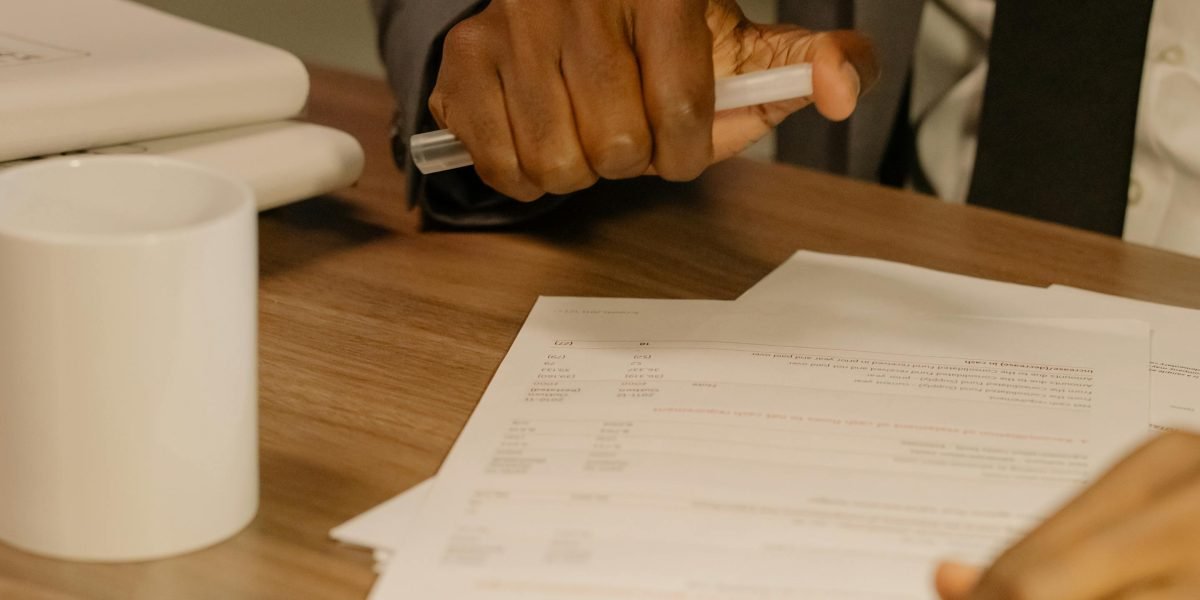A professional reviewing documents, symbolizing careful consideration in real estate investment.