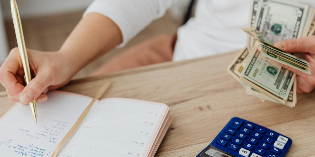 A person focused on calculating and managing business finances.