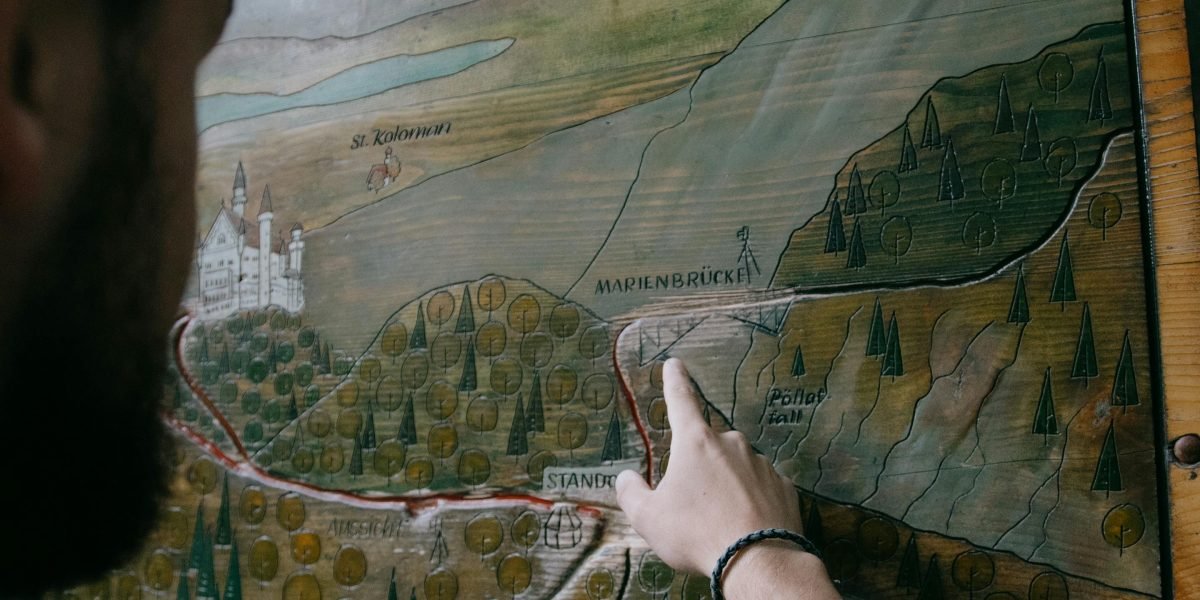 A person using a map to accurately pinpoint a location, illustrating the precision provided by Makani numbers.
