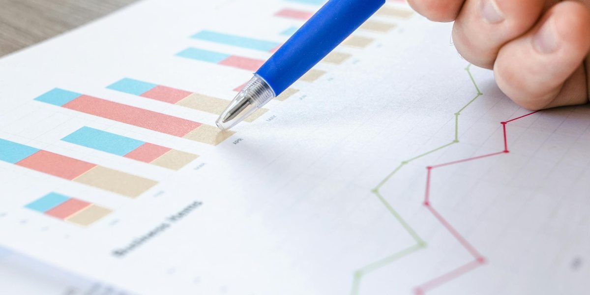 A business professional reviewing charts and data to measure the success of their networking efforts.