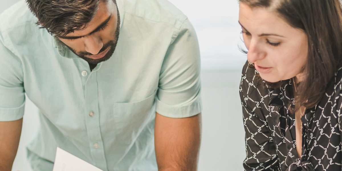 A consultant providing tailored advice to a business owner for setup.