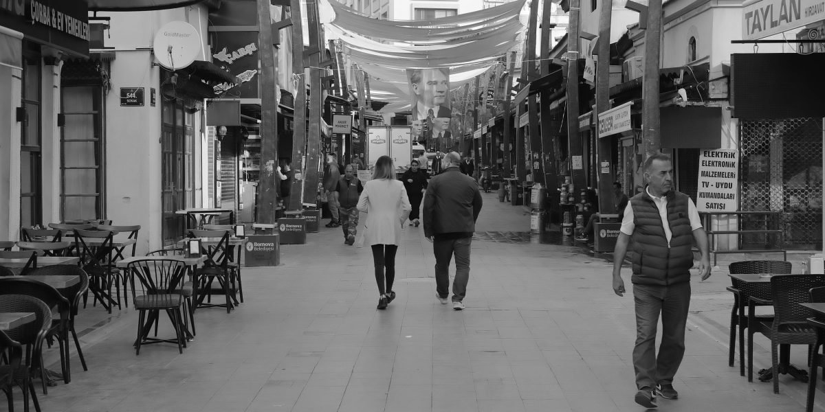 People enjoying a vibrant, walkable mixed-use community, symbolizing convenience and connection.