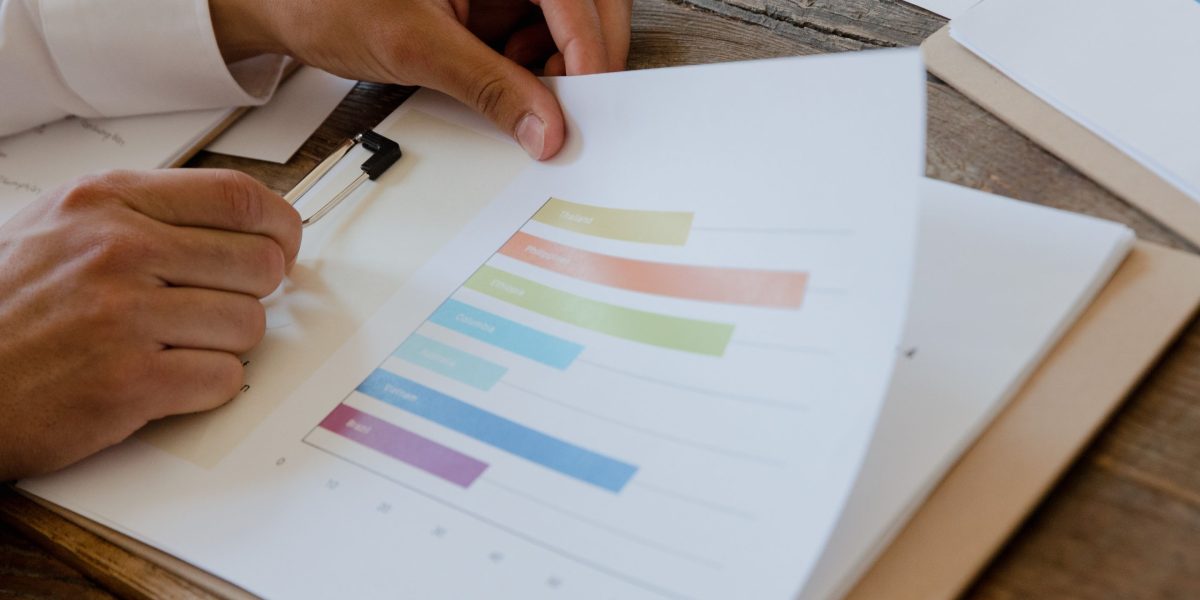 An individual focused on reviewing their financial plan, making informed decisions for their future investments.