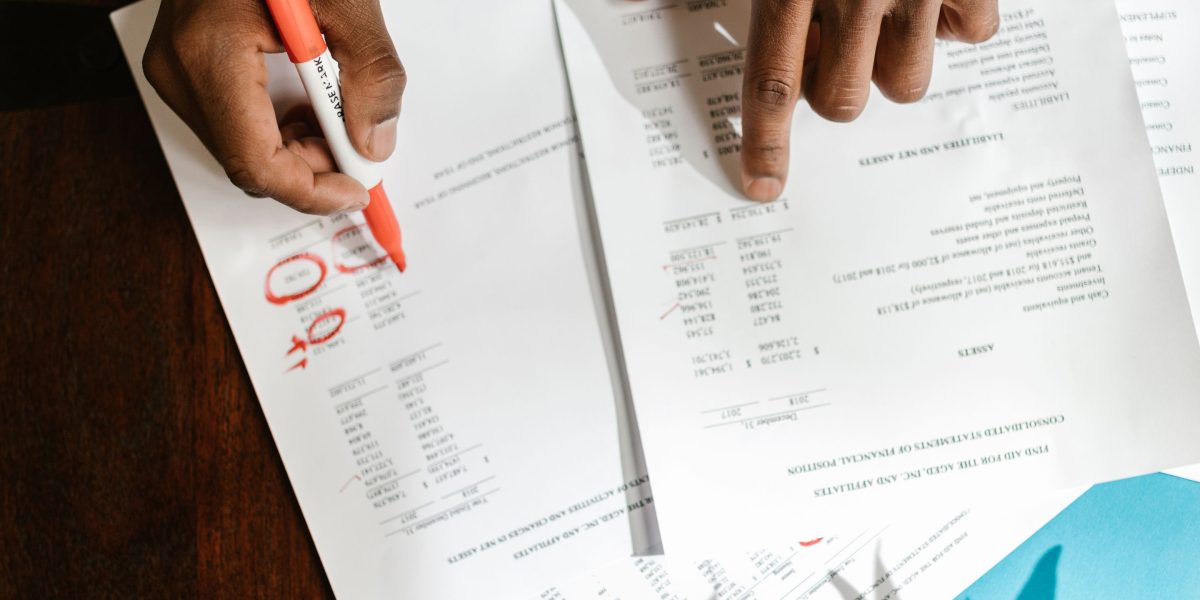 A person focused on researching various options, diligently planning their next steps.