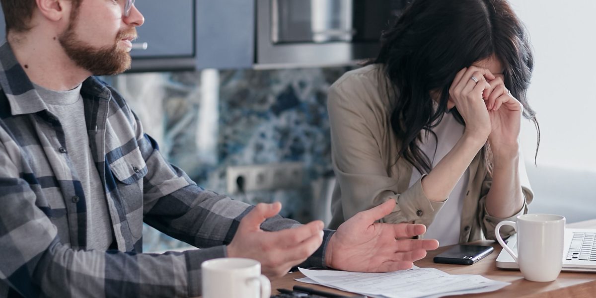 Individuals thoughtfully weighing their choices for buying, renting, or investing in Dubai's diverse property market.